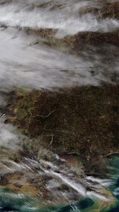 From NASA’s Terra satellite, an image of fallstreak holes in clouds over the southern United States (© NASA) mobile wallpaper