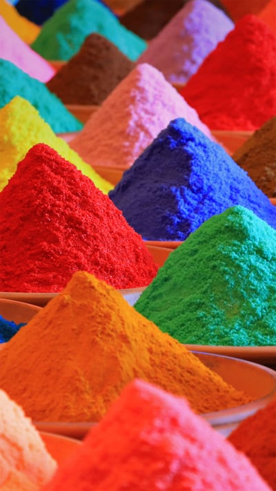 Multicolored powders for sale during Holi (© Nuno Valadas/Getty Images) mobile wallpaper