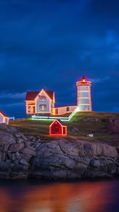 Holiday lights on Cape Neddick Light in York, Maine (© Walter Bibikow/Alamy) mobile wallpaper