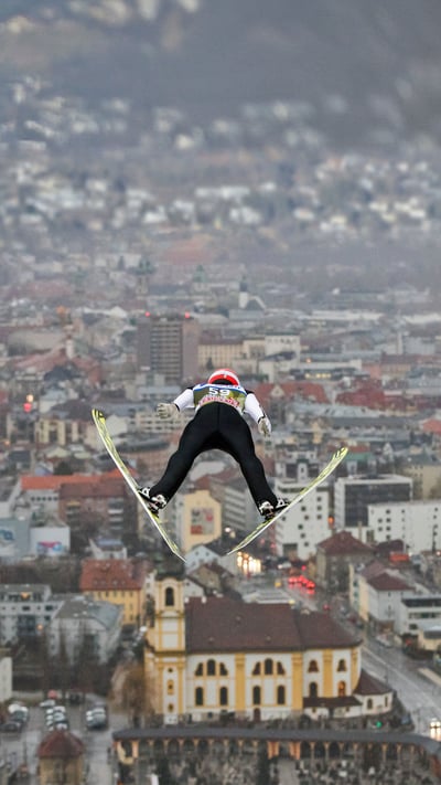 German ski jumper Markus Eisenbichler competing in the Four Hills Tournament, Innsbruck, Austria, on January 3, 2018 (© Daniel Karmann/picture alliance via Getty Images) mobile wallpaper