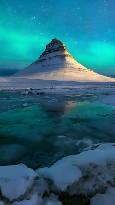 Kirkjufell, Snæfellsnes peninsula, Iceland (© Ratnakorn Piyasirisorost/Getty Images) mobile wallpaper