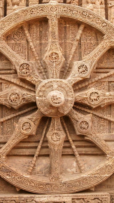 A stone wheel engraved in the walls of the Konarak Sun Temple in Orissa, India (© JeremyRichards/Getty Images) mobile wallpaper