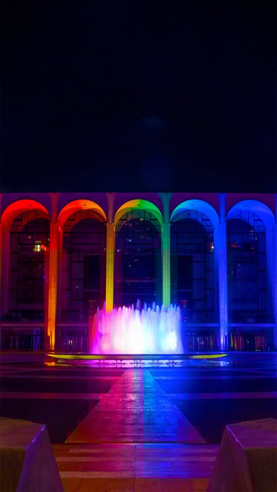 Lincoln Center for the Performing Arts lit in Pride colors on June 18, 2020 in New York City (© Alexi Rosenfeld/Getty Images) mobile wallpaper