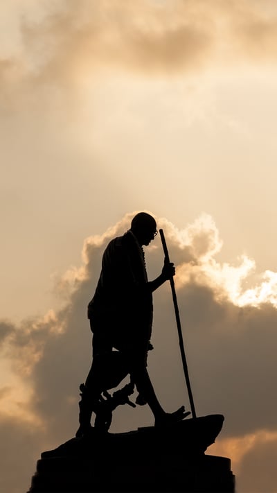 Mahatma Gandhi statue in Chennai at sunset with dramatic sky (© cornfield/Shutterstock) mobile wallpaper