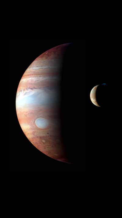 Montage of images of Jupiter and its volcanic moon Io (© NASA/Johns Hopkins University Applied Physics Laboratory/Southwest Research Institute/Goddard Space Flight Center) mobile wallpaper