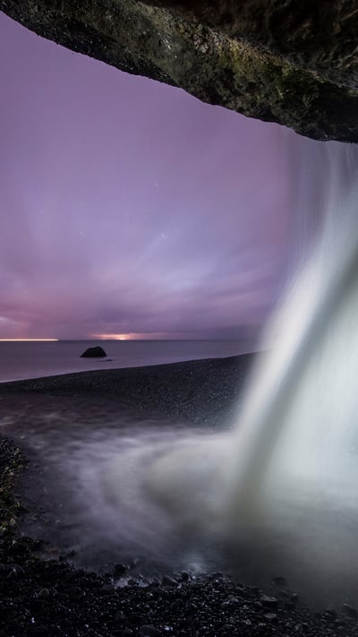 View of a waterfall at Mystic Beach in Juan de Fuca Provincial Park, B.C. during dusk (© DEEPOL/Plainpicture) mobile wallpaper
