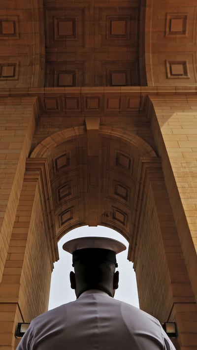 A sailor pays respect at India Gate War Memorial, Delhi. (© Adnan Abid/Reuters) mobile wallpaper
