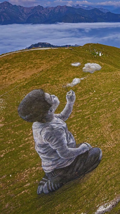 'A New Breath' by artist Saype in Moléson-sur-Gruyères, Switzerland (© Valentin Flauraud/Shutterstock) mobile wallpaper