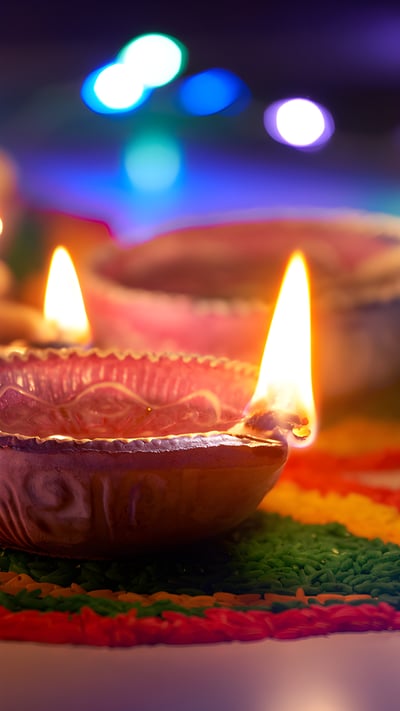 Oil lamps lit during Diwali (© phive2015/Getty Images) mobile wallpaper