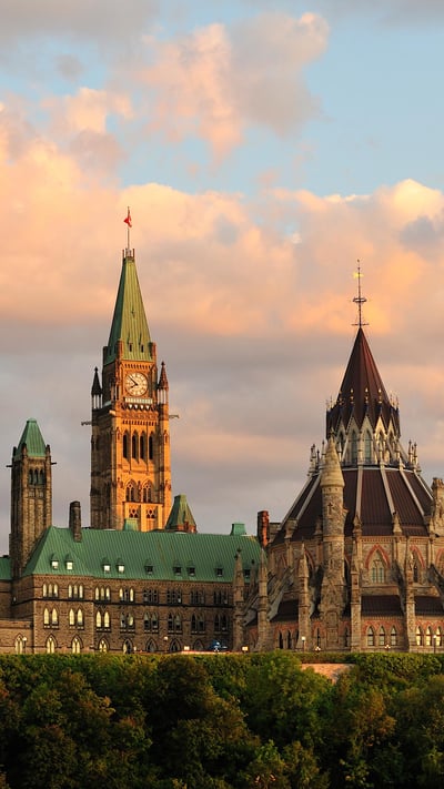 Parliament Building in Ottawa at sunset (© Serega/Getty Images) mobile wallpaper