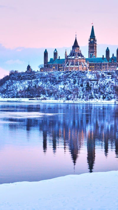 View of the Parliament Hill in winter, Ottawa (© Thomas Brissiaud/Shutterstock) mobile wallpaper