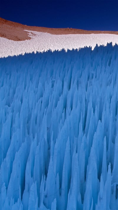 Nieve penitente ice formations seen on Agua Negra Pass in the Coquimbo Region of the Andes, Chile (© Art Wolfe/Danita Delimont) mobile wallpaper