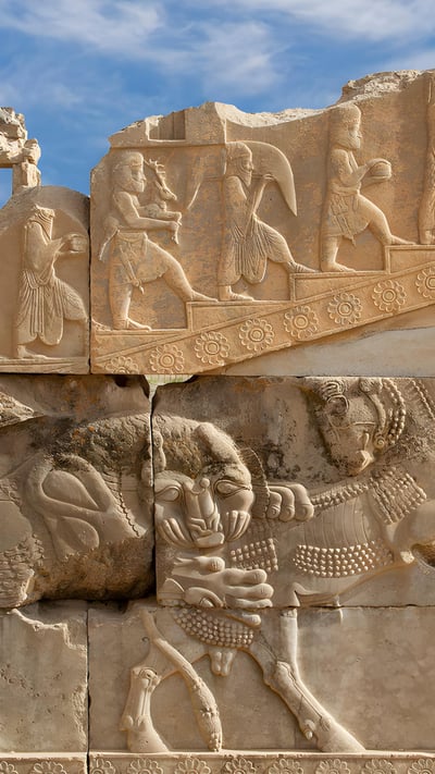 Reliefs in the ancient Persian city of Persepolis, Iran (© Ozbalci/Getty Images) mobile wallpaper