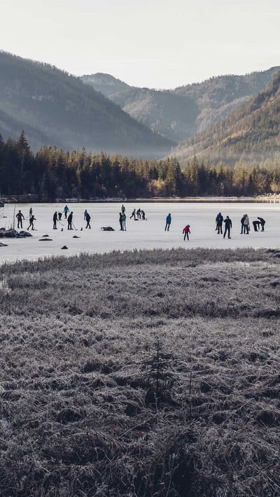Ice skaters on Hintersee, a lake in Ramsau, Berchtesgadener Land, Bavaria, Germany (© Jana Mänz/Westend61/Offset) mobile wallpaper