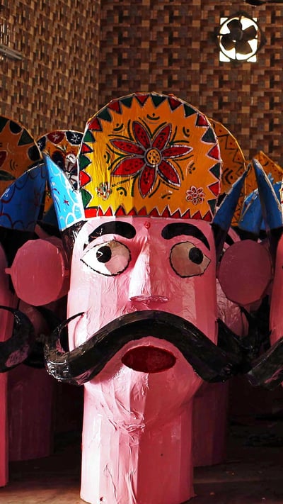 An artisan applies final touches to an effigy of Ravana in Jammu, India (© Mukesh Gupta/Reuters) mobile wallpaper