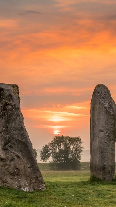 Dawn breaks over the ancient Sarsen Stones at Avebury, Wiltshire, at Summer Solstice (© Terry Mathews/Alamy Stock Photo) mobile wallpaper