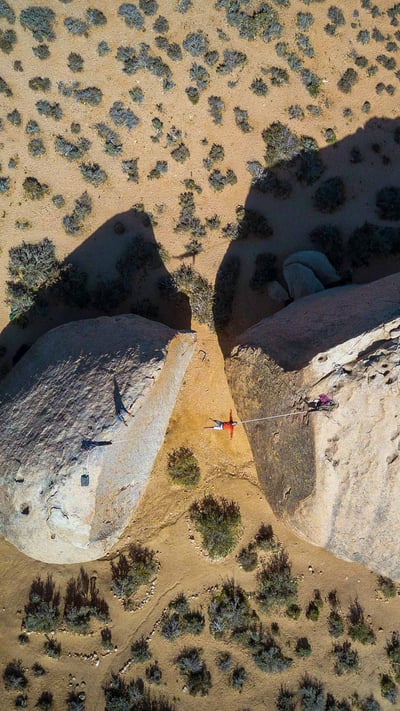 Slacklining between giant boulders in Bishop, California (© Evgeny Vasenev/Aurora Photos) mobile wallpaper