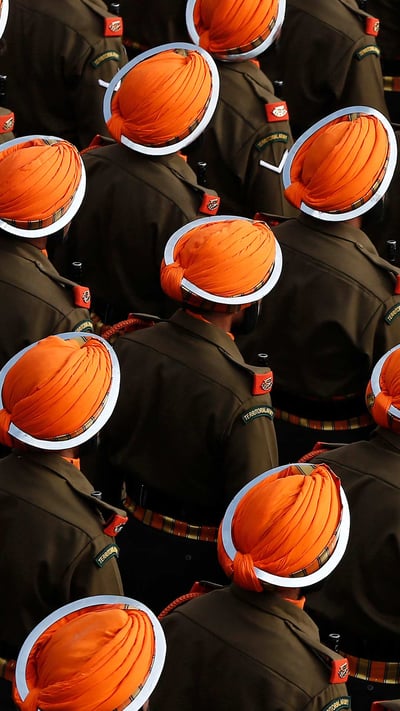 Indian army soldiers march during a dress rehearsal for the Republic Day parade (© Adnan Abidi/Reuters) mobile wallpaper