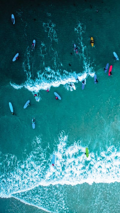 Aerial view of surfers in Cornwall for International Surfing Day (© Matt Cooper/Gallery Stock) mobile wallpaper