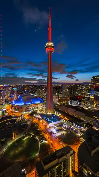 CN Tower illuminated at night in Toronto, Ontario (© R.M. Nunes/Shutterstock) mobile wallpaper