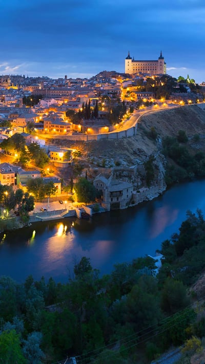 Panoramic view of the city of Toledo after sunset, Spain (© Frank Fischbach/Alamy) mobile wallpaper