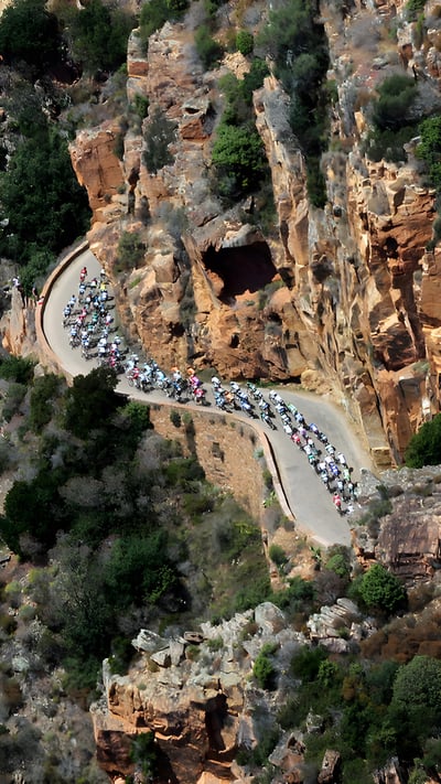 Cyclists in the 2013 Tour de France, Corsica, France (© Pascal Pochard-Casabianca/AFP via Getty Images) mobile wallpaper