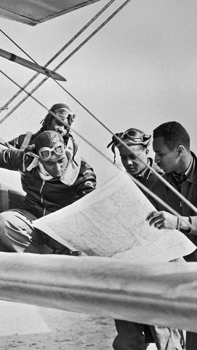 Tuskegee Airmen reading a map (© Bettmann/Getty Images) mobile wallpaper