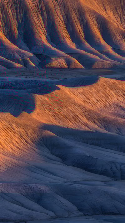 Sandstone formations in the badlands near Caineville, Utah (© Chris Moore/TANDEM Stills + Motion) mobile wallpaper
