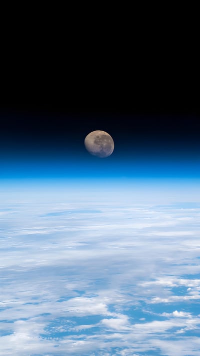 Waning gibbous moon above the Earth's horizon, photographed from the International Space Station (© NASA) mobile wallpaper