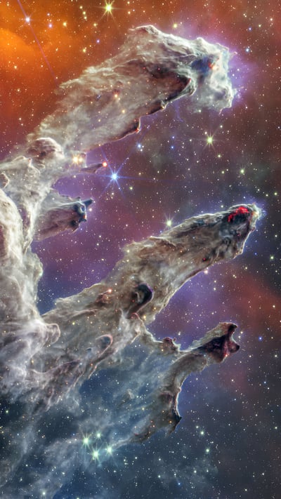 The Pillars of Creation viewed by the James Webb Space Telescope (© NASA) mobile wallpaper