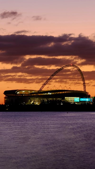 Wembley Stadium at sunset, London (© Charles Bowman/Alamy) mobile wallpaper