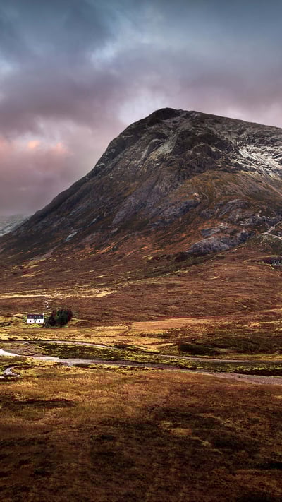 The Lagangarbh hut nestles in the valley beneath Buachaille Etive Mòr, Glencoe (© Sophia Spurgin Photography/iStock/Getty Images Plus) mobile wallpaper